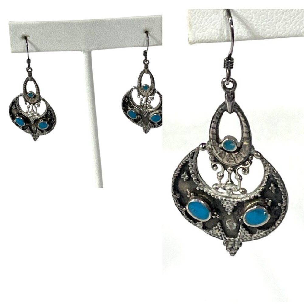Sterling silver and turquoise pierced dangle earrings.
